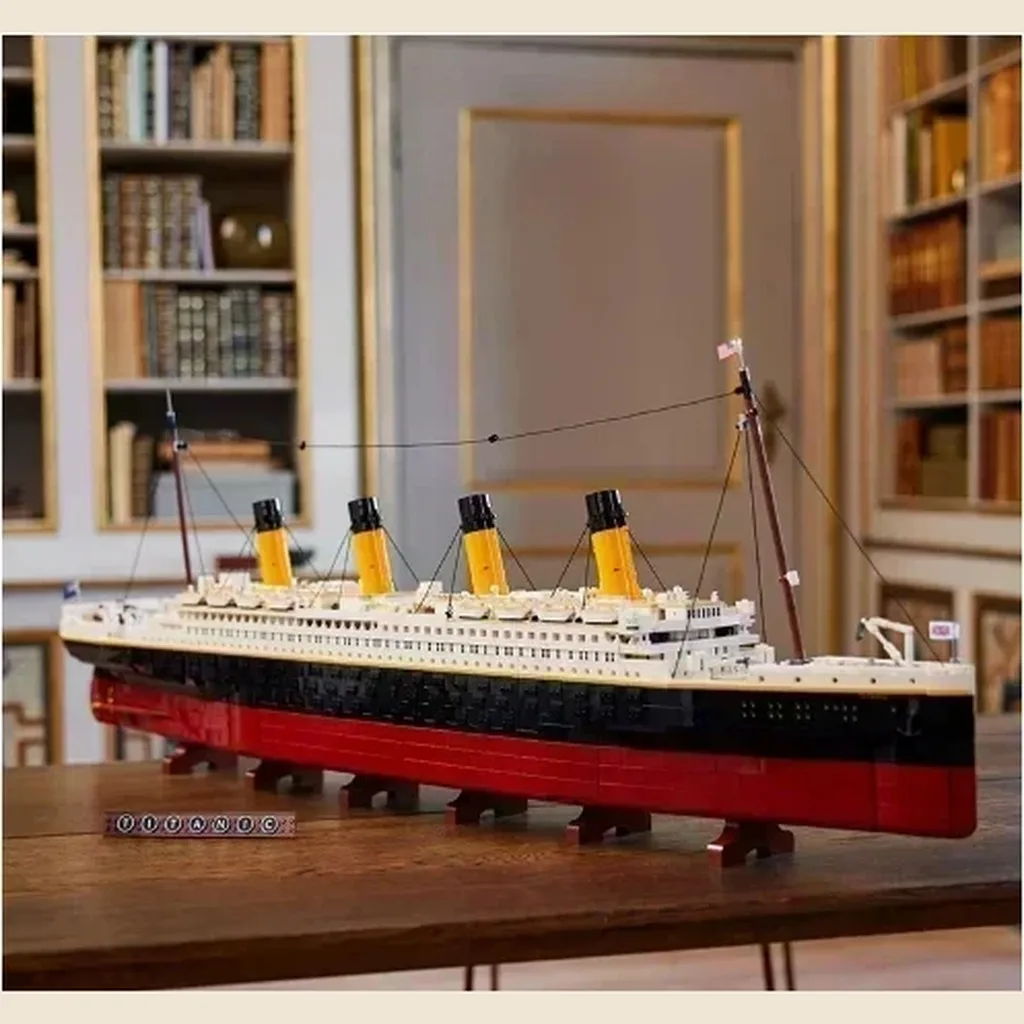 A finished brick ocean liner on a table in front of a library wall